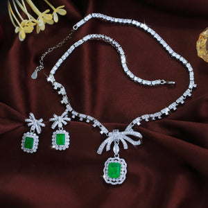 Vibrant Rhodium Plated Bow-Knot Emerald Baguette CZ Jewelry Set Green Paraiba and Zircon Necklace Earrings Wedding Jewelry Set Jovera Joyce