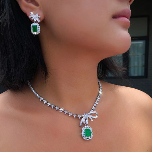 Vibrant Rhodium Plated Bow-Knot Emerald Baguette CZ Jewelry Set Green Paraiba and Zircon Necklace Earrings Wedding Jewelry Set Jovera Joyce