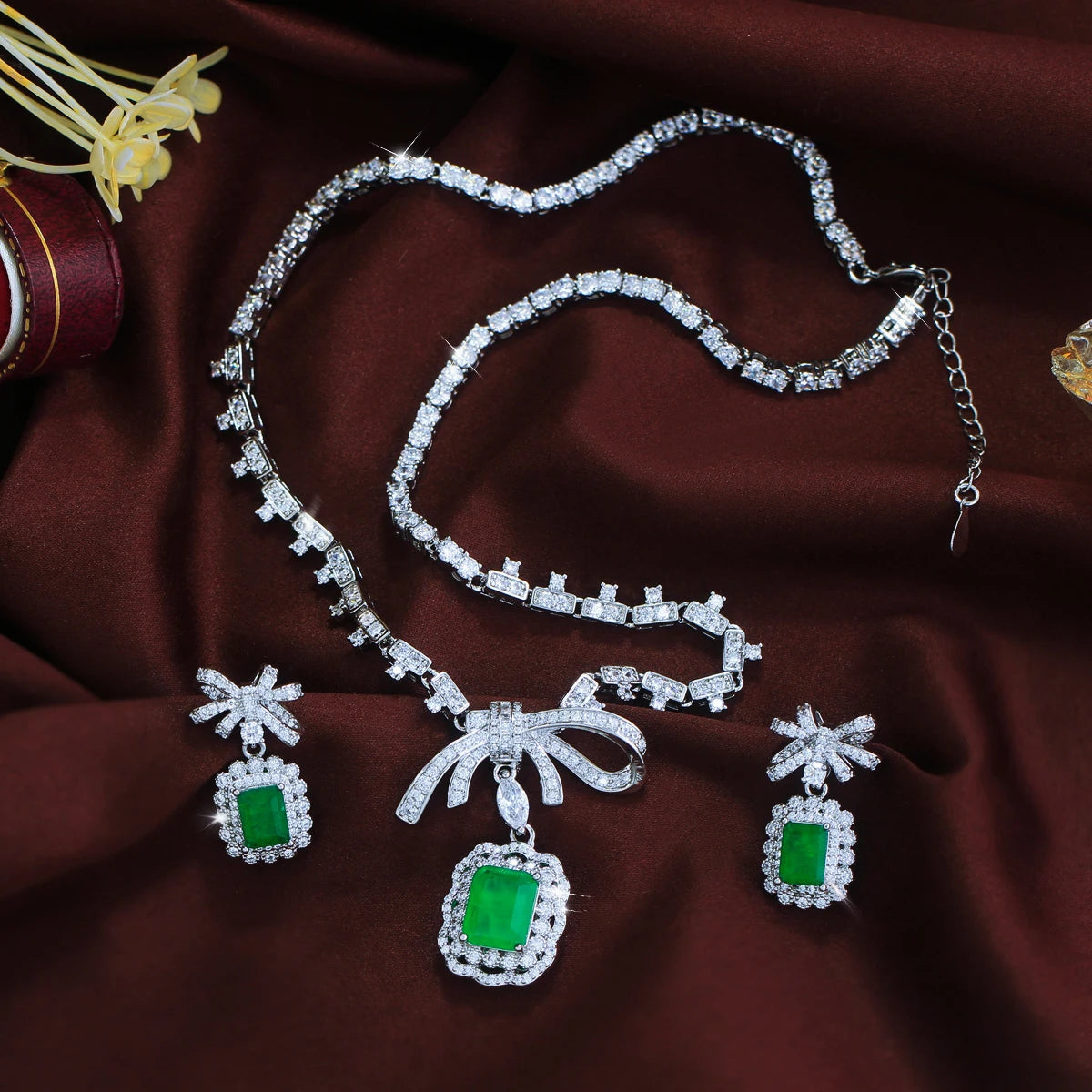 Vibrant Rhodium Plated Bow-Knot Emerald Baguette CZ Jewelry Set Green Paraiba and Zircon Necklace Earrings Wedding Jewelry Set Jovera Joyce